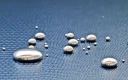 قطرات جیوه روی سطح آبی بافتی